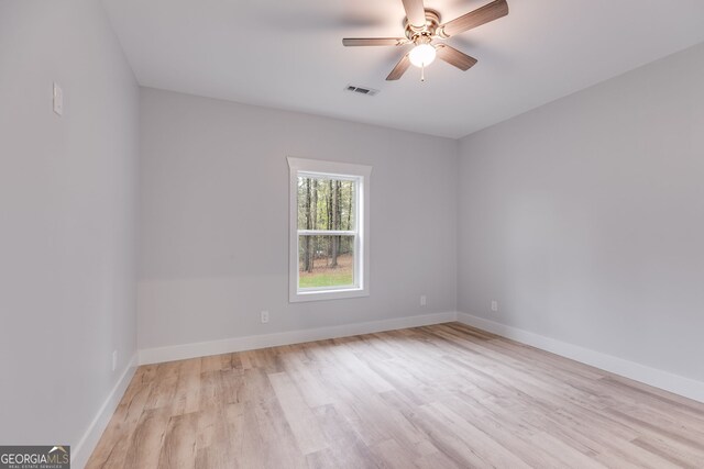 interior space with built in desk, light hardwood / wood-style floors, and plenty of natural light