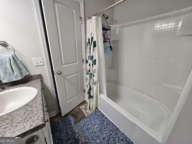 bathroom featuring vanity and shower / tub combo with curtain