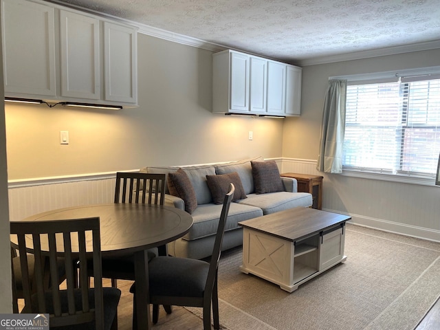 kitchen featuring stainless steel fridge and white cabinetry