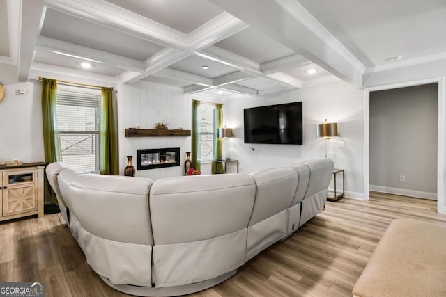 living room featuring beam ceiling, coffered ceiling, and wood-type flooring