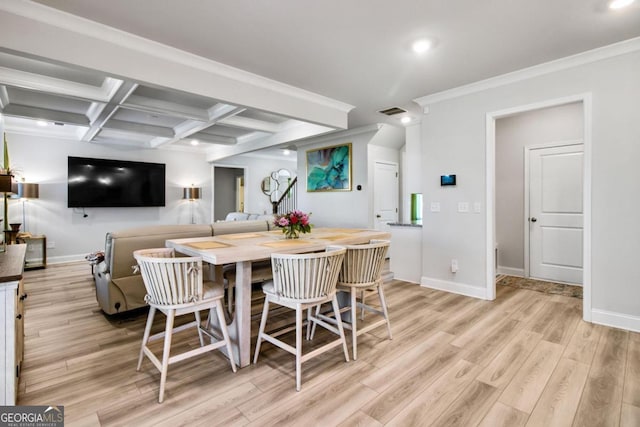 dining space with beamed ceiling, coffered ceiling, crown molding, and light wood-type flooring