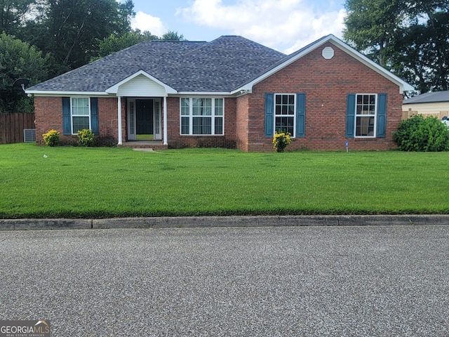 single story home with a front lawn