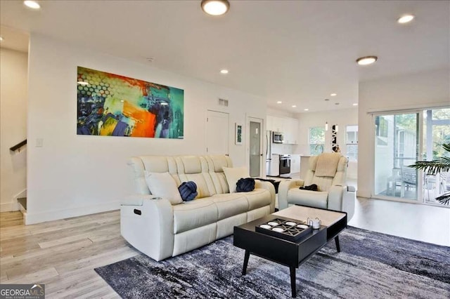 living room with light hardwood / wood-style floors