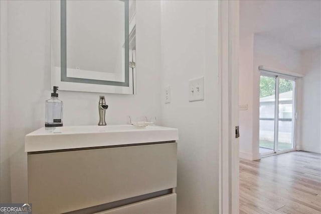 bathroom with vanity and hardwood / wood-style floors