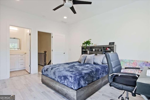 bedroom featuring light hardwood / wood-style floors, connected bathroom, and ceiling fan