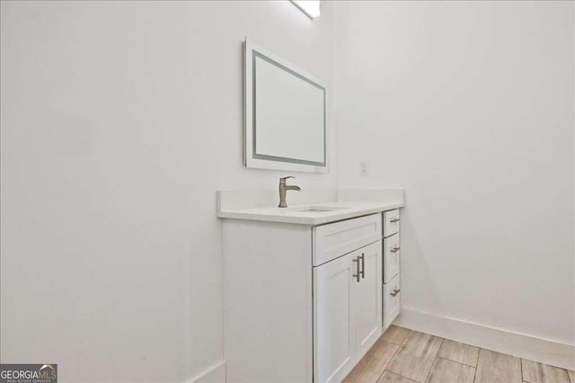 bathroom featuring vanity and hardwood / wood-style floors