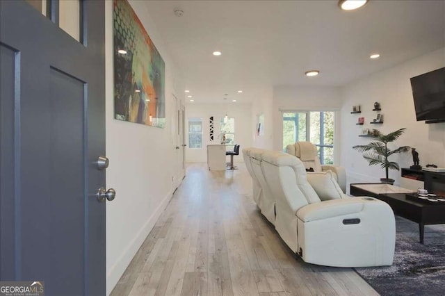 living room with light hardwood / wood-style floors