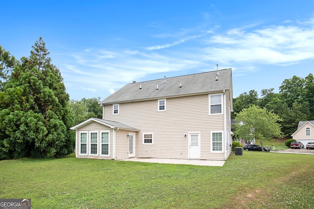 back of house with a patio, central AC unit, and a lawn