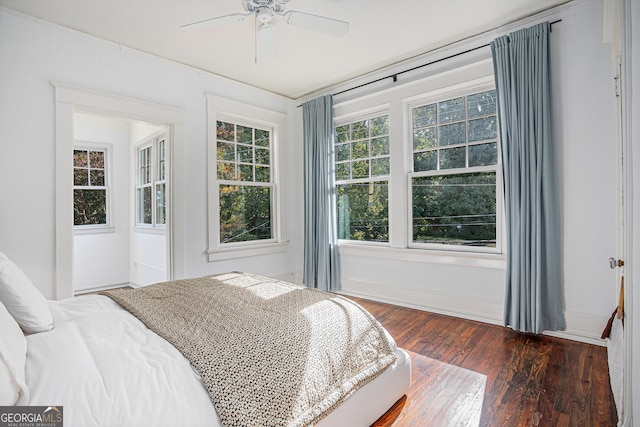 bedroom with dark wood-type flooring and ceiling fan