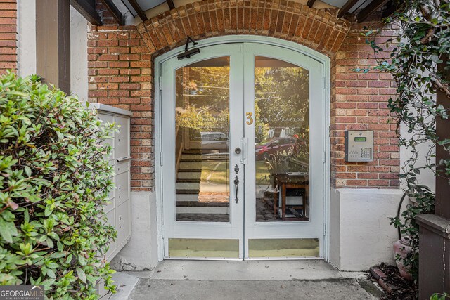 doorway to property featuring french doors