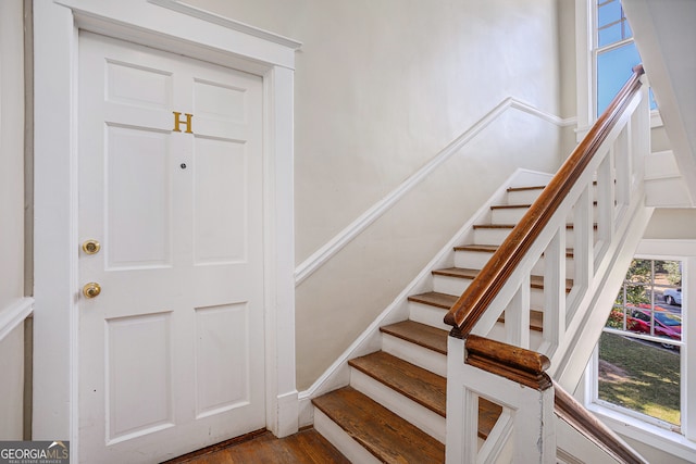 stairway featuring hardwood / wood-style floors