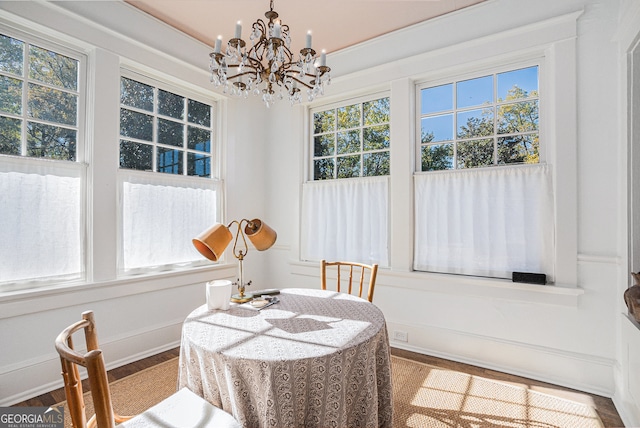 dining area with a chandelier and hardwood / wood-style floors