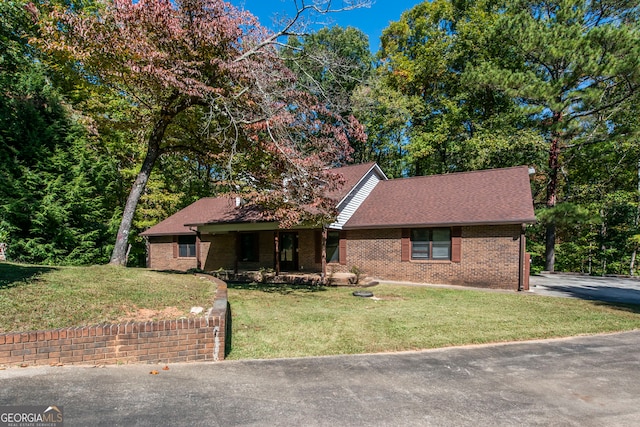 view of front of home with a front lawn