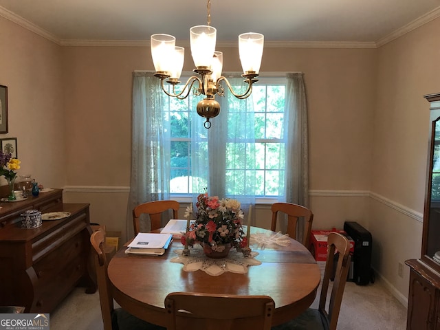 carpeted dining space featuring crown molding and a chandelier