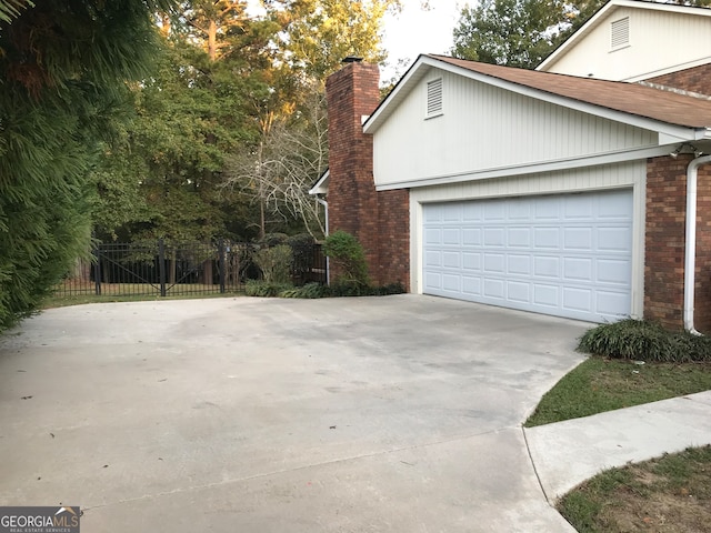 view of side of home featuring a garage