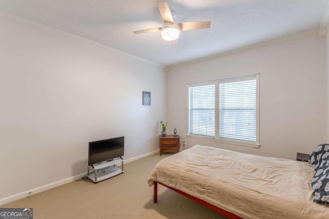 bedroom featuring ceiling fan, carpet flooring, a textured ceiling, and ornamental molding