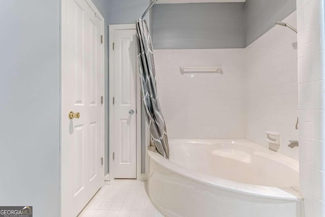 bathroom featuring shower / tub combo with curtain and tile patterned floors