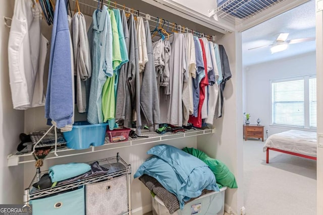 spacious closet featuring carpet floors and ceiling fan