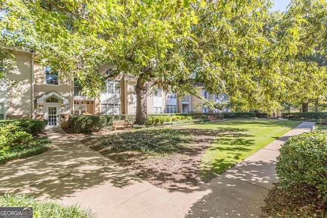 view of community featuring a yard