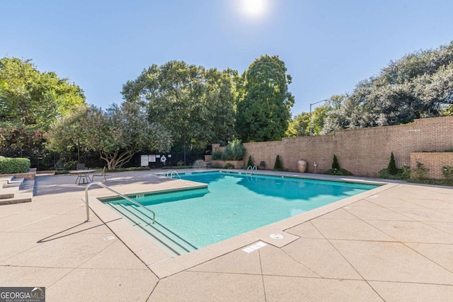 view of pool featuring a patio area