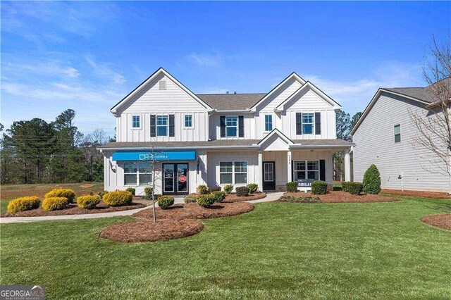 view of front of house featuring a front yard and a porch