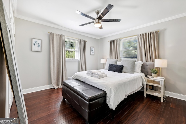 bedroom with ornamental molding, dark hardwood / wood-style floors, and ceiling fan