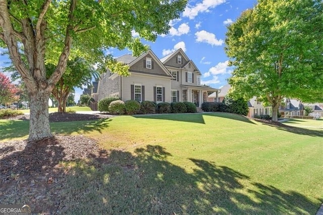 view of front of property with a front lawn