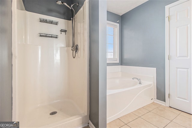 bathroom with tile patterned floors and separate shower and tub