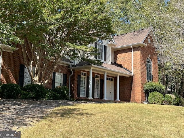 front facade with a front lawn