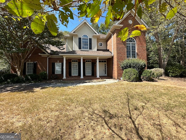 view of property with a front lawn