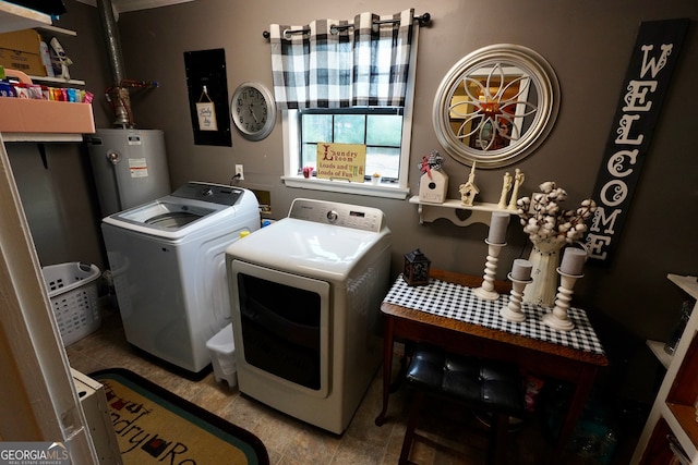 clothes washing area featuring separate washer and dryer and gas water heater