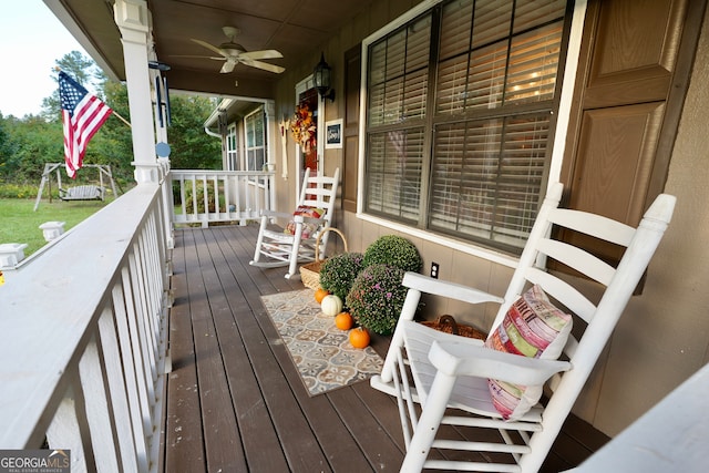 deck featuring covered porch and ceiling fan