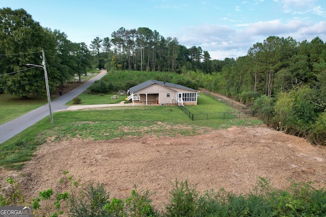 view of front of house featuring a rural view and a front yard