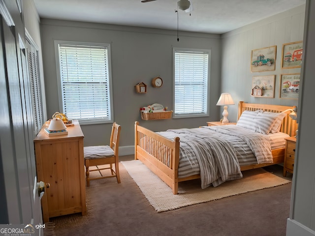 carpeted bedroom with a closet and ceiling fan