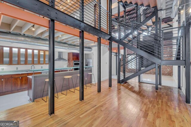 interior space featuring sink and light hardwood / wood-style flooring