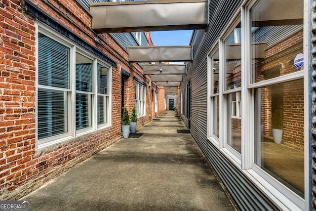 view of side of property featuring a patio area