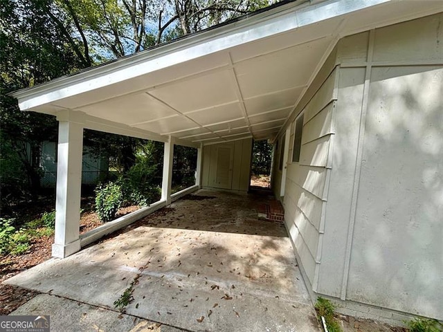 view of vehicle parking with a carport