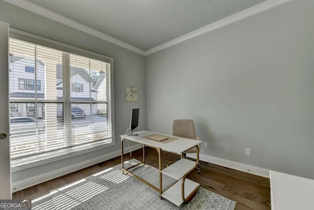 office featuring baseboards, ornamental molding, and wood finished floors