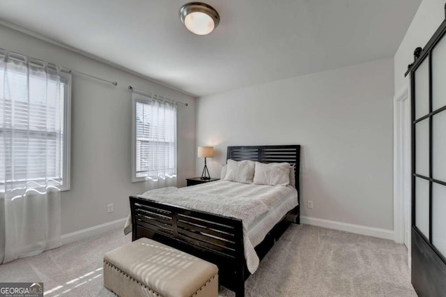 carpeted bedroom with baseboards