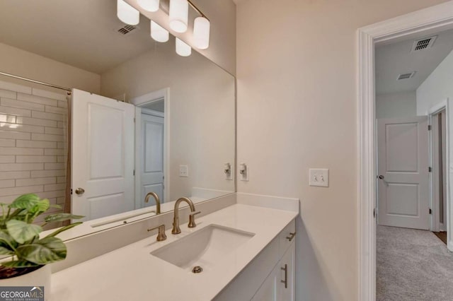 bathroom with vanity and visible vents