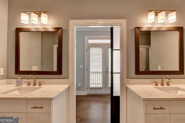 bathroom with vanity and wood-type flooring