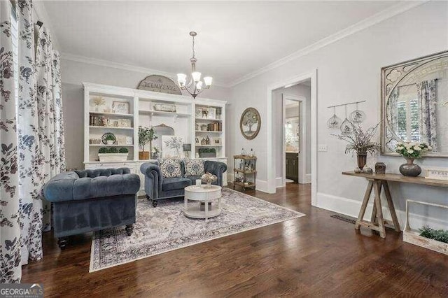 living area with crown molding, dark hardwood / wood-style flooring, a chandelier, and built in features