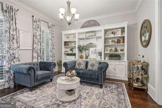 sitting room featuring crown molding, dark wood-type flooring, and a notable chandelier