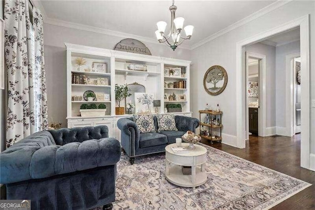 living room featuring dark hardwood / wood-style floors, ornamental molding, and an inviting chandelier