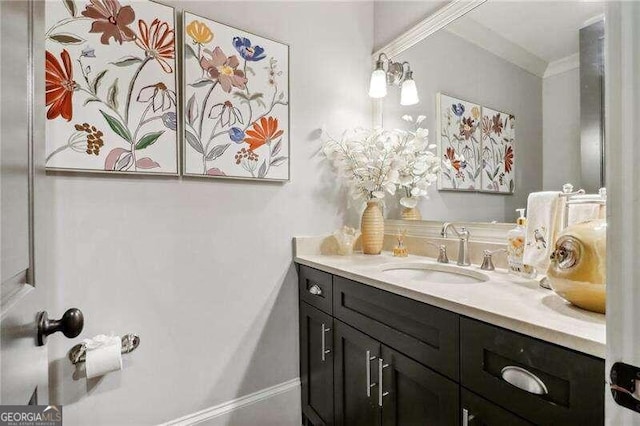 bathroom featuring vanity and crown molding