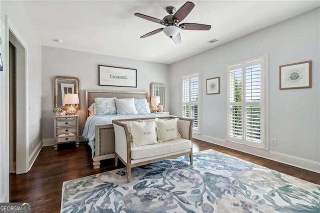 bedroom featuring ceiling fan and dark wood-type flooring