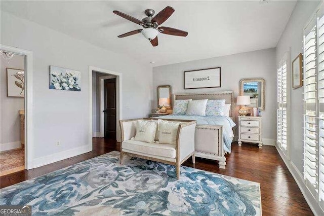 bedroom featuring dark hardwood / wood-style flooring and ceiling fan