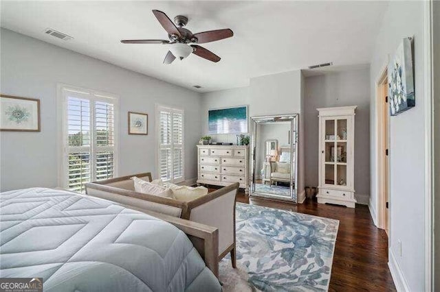 bedroom with ceiling fan and dark wood-type flooring