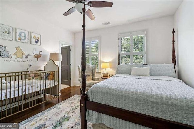 bedroom featuring hardwood / wood-style floors and ceiling fan