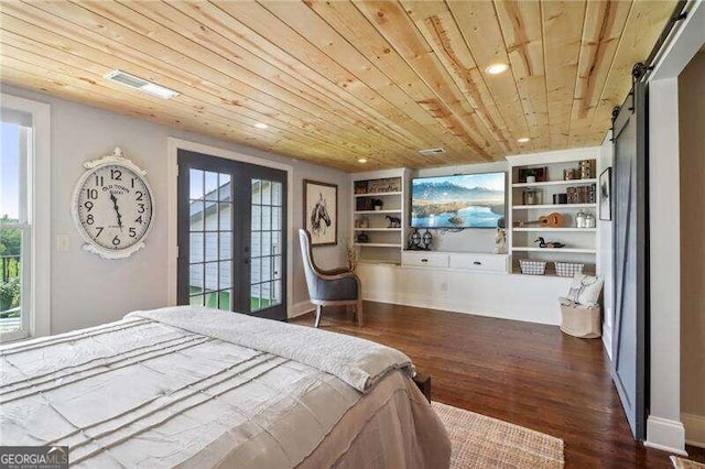 bedroom with a barn door, dark hardwood / wood-style flooring, wooden ceiling, and multiple windows